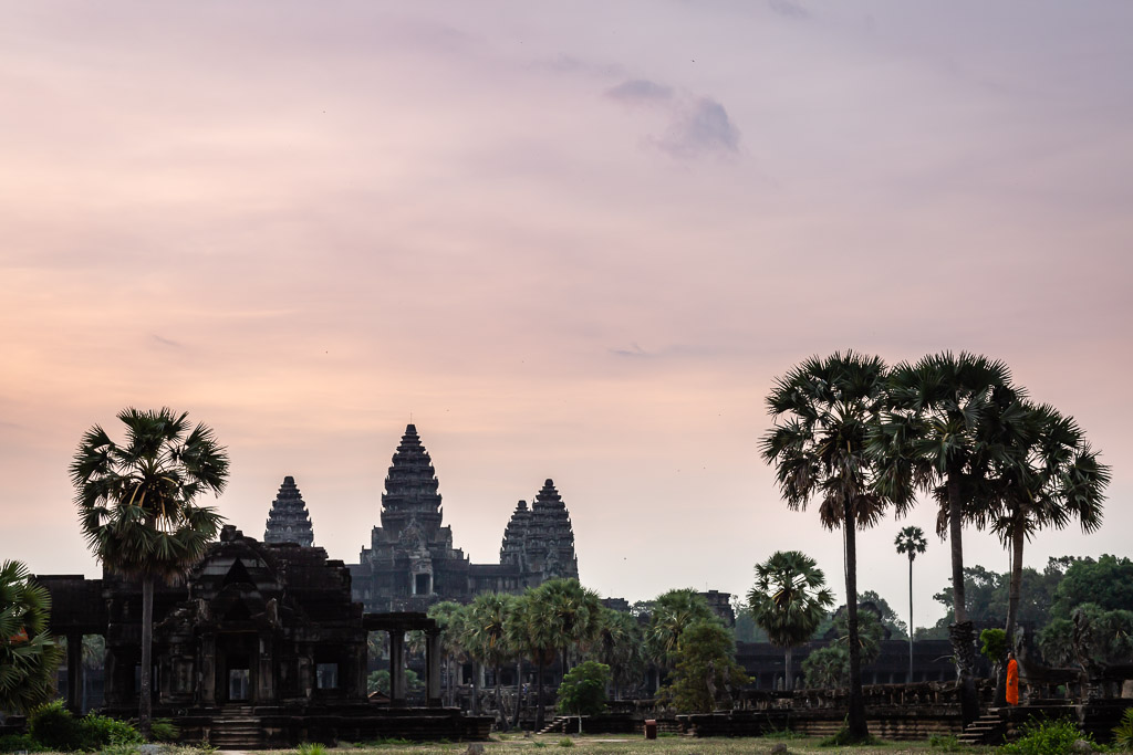 Lonely Monk at sunrise in Angkor Wat during pandemic