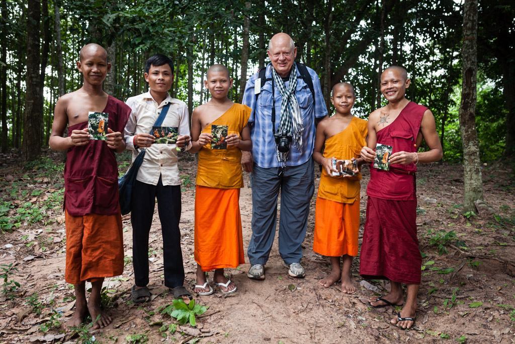 Greg is a return costumer visiting the same monastery and giving away pictures he took a few month before