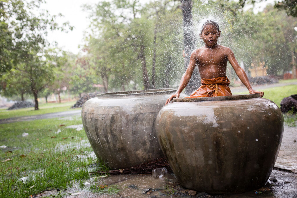Monk in the rain in Cambodia