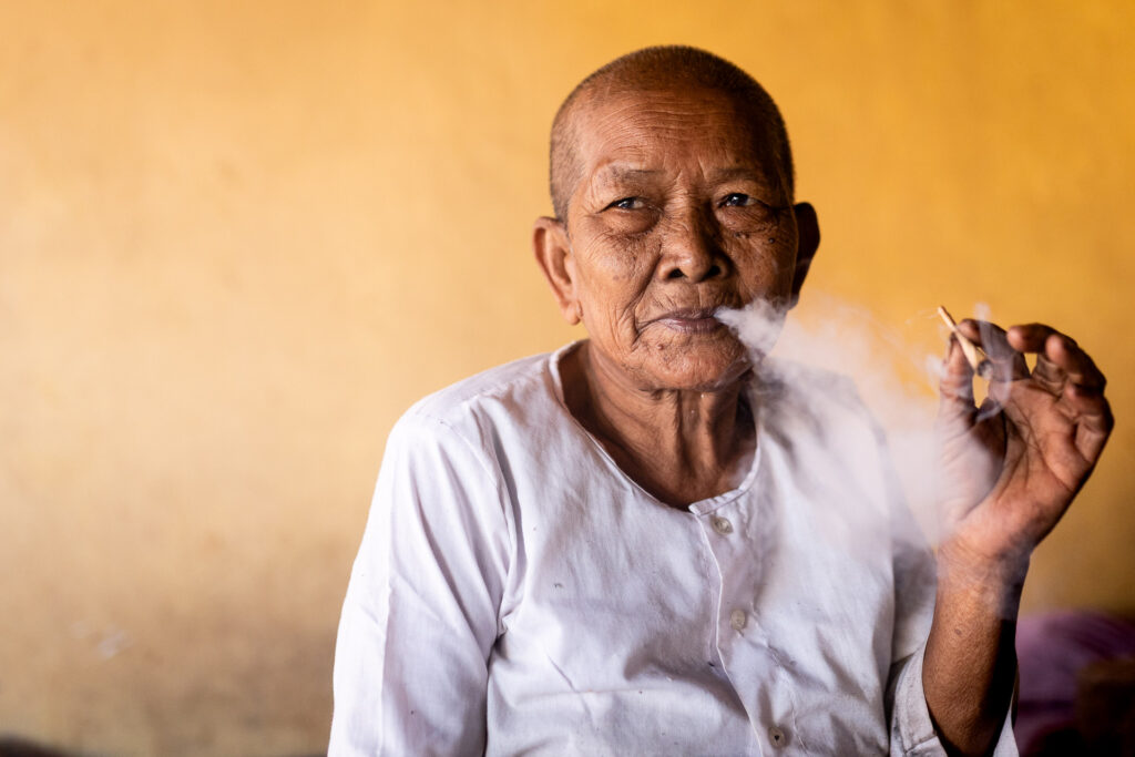 Portrait of a Khmer lady smoking on 2 November 2022