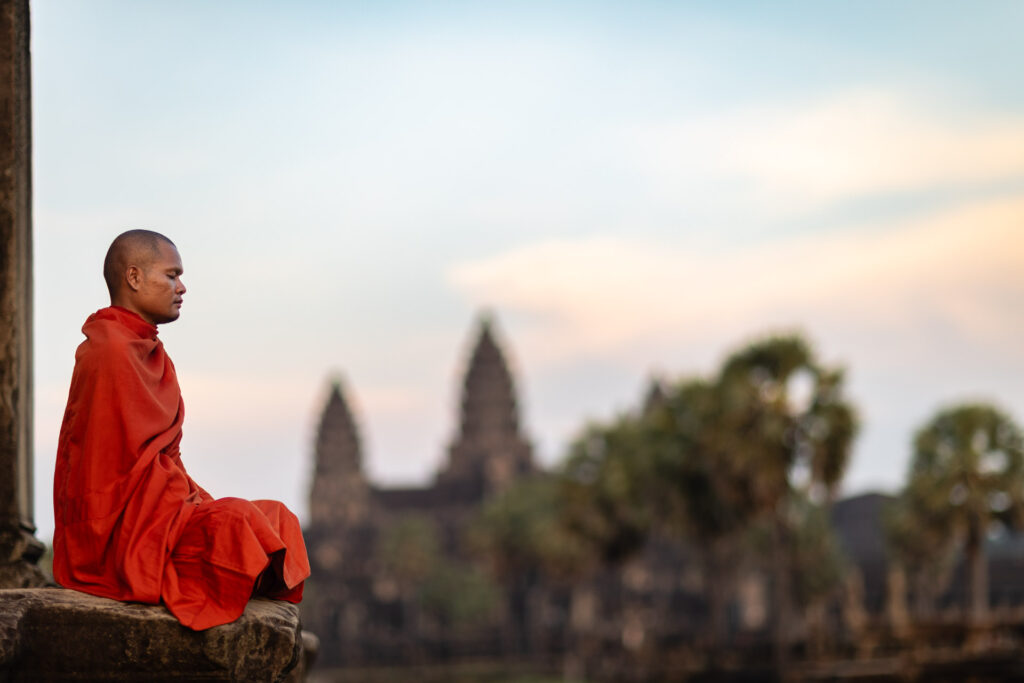 “A monk at Angkor Wat” — classic, symbolic, a sure crowd-pleaser.