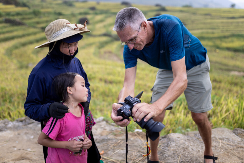 Jean Yves sharing his images with Hmong people by E.T.