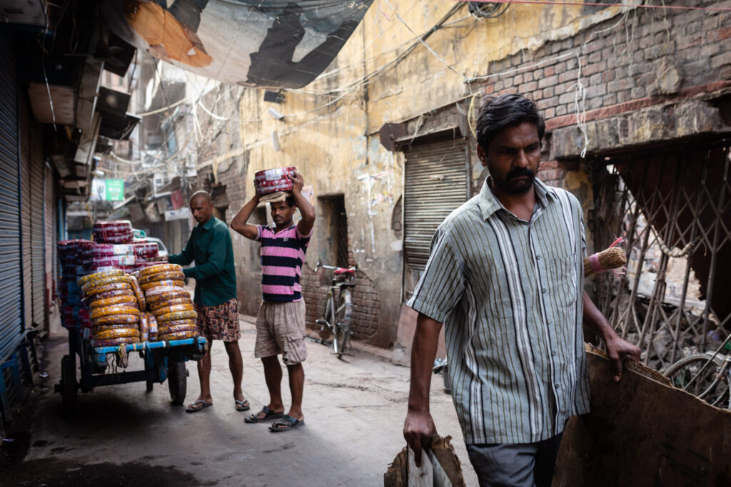 Person naturally walking through a busy street in India