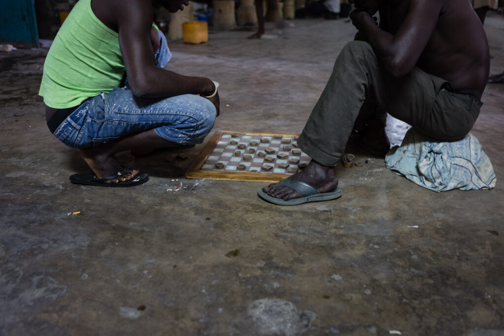 Prisoners playing boardgame
