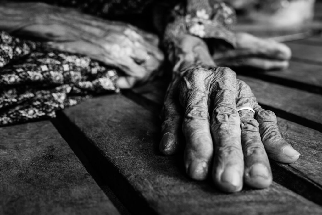 Close up of hands of a old cambodian lady