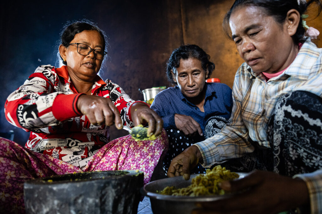 Women cooking for the monks